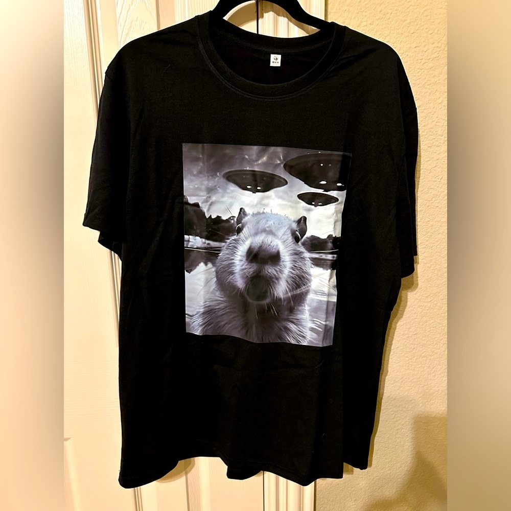 NWT funny novelty T-shirt flying saucers.  Black .  Marked 2x but closer to XL